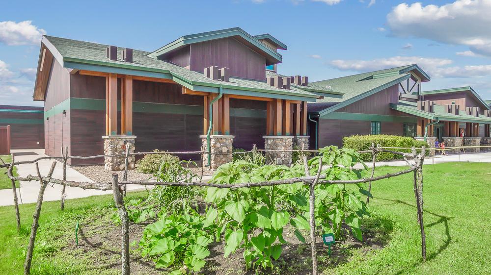 The Lewis & Clark Interpretive Center utilizing Nichiha’s Illumination and RoughSawn fiber cement cladding in dark brown and green.