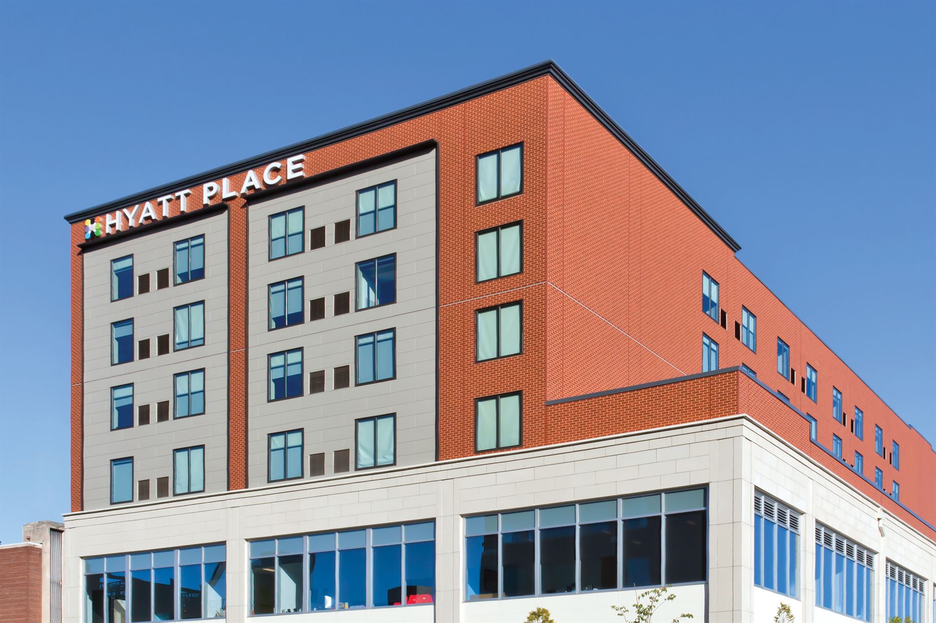 A Hyatt Place hotel utilizing a mixture of gray and red brick Nichiha fiber cement siding.