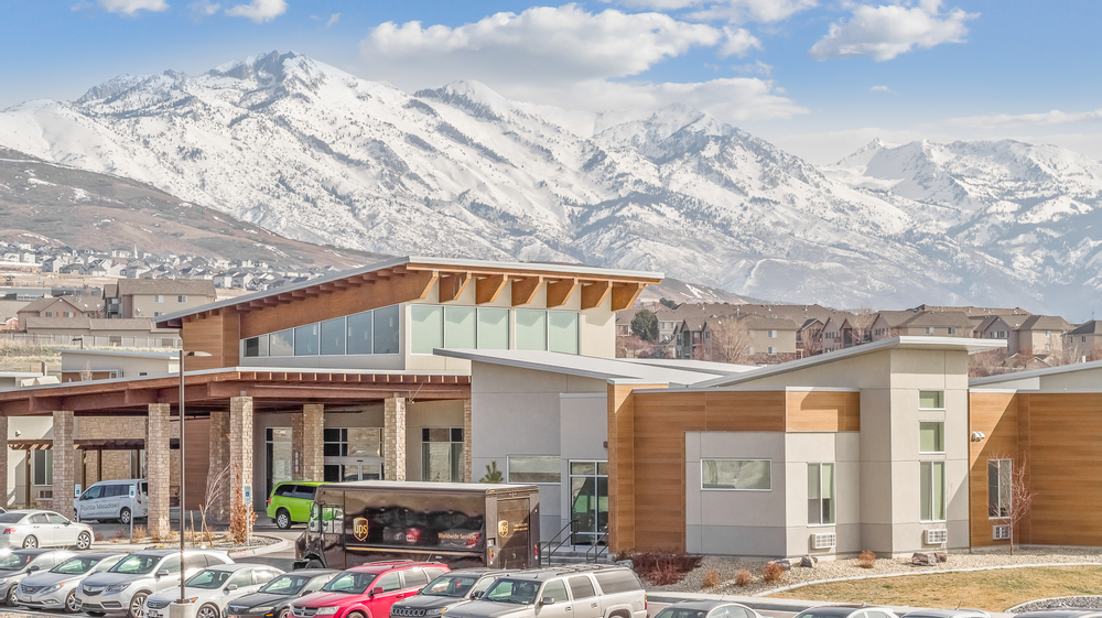 A faraway shot of Lehi Skilled Nursing Facility in Utah utilizing Nichiha’s EmpireBlock fiber cement cladding in gray and VintageWood fiber cement cladding.