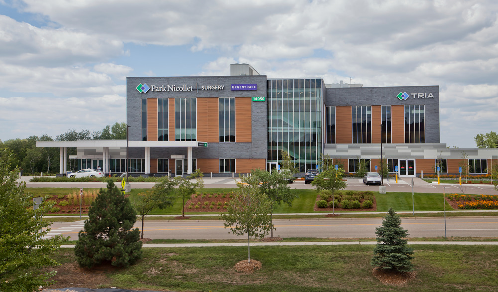 A faraway shot of Park Nicollet Surgery healthcare building decorated with Nichiha’s VintageWood and Illumination series fiber cement cladding.