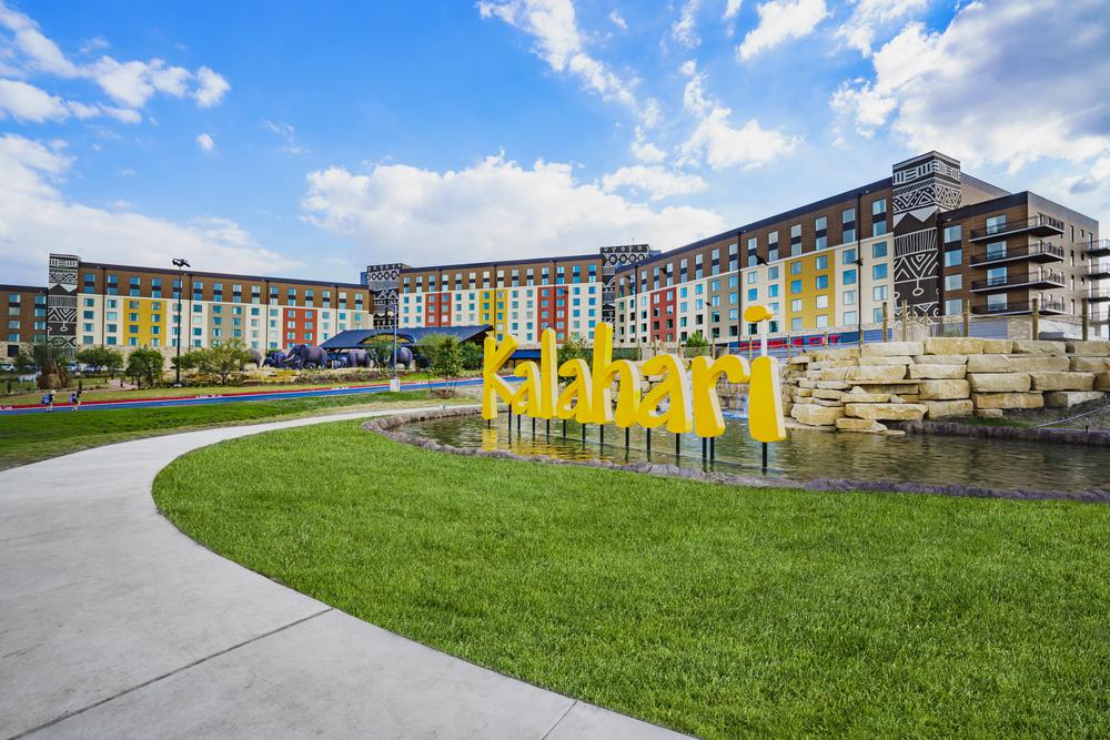 Kalahari resort sign in yellow in the Wisconsin Dells with buildings behind using Nichiha’s modular construction installation.