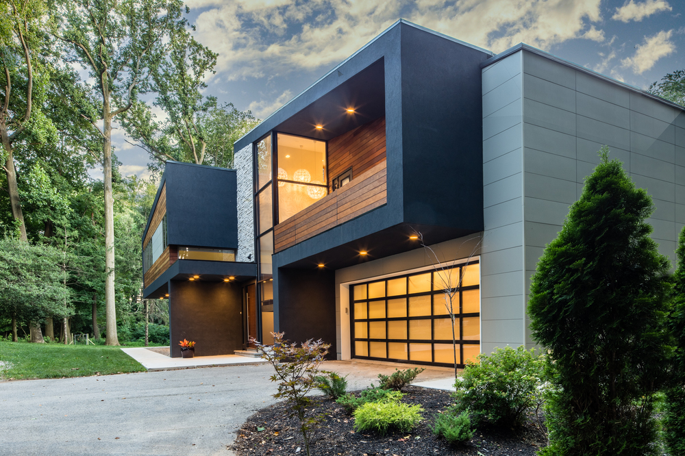 A modern home with Nichiha’s black, brown, and grey fiber cement siding.