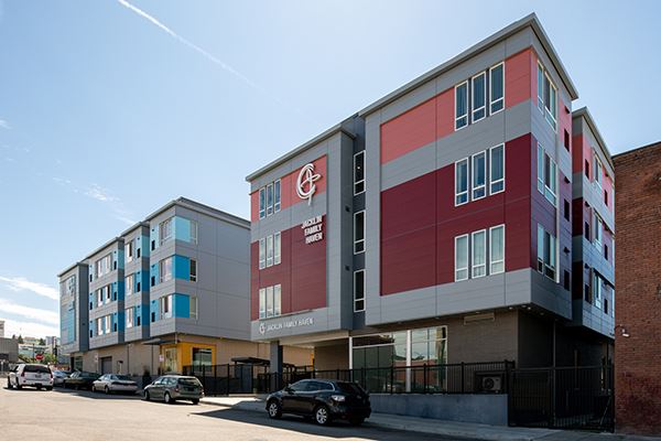Street view of red and blue Jacklin Haven multifamily buildings