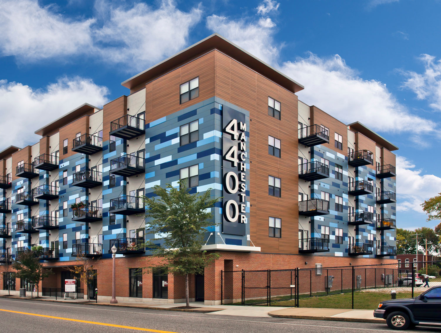 exterior of 4400 manchester lofts with multiple shades of blue on the exterior
