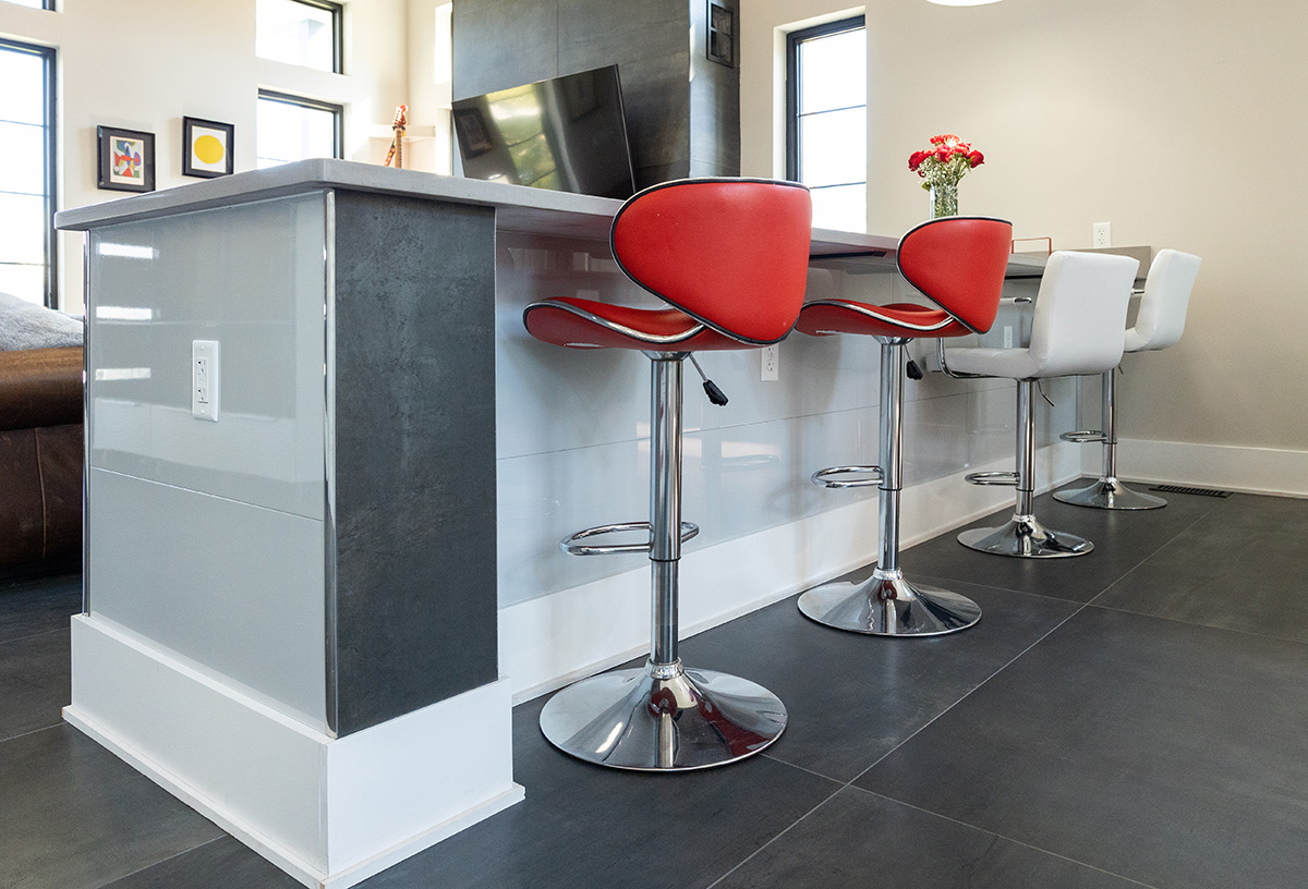 A kitchen island wrapped with Miraia Glacier architectural wall panels