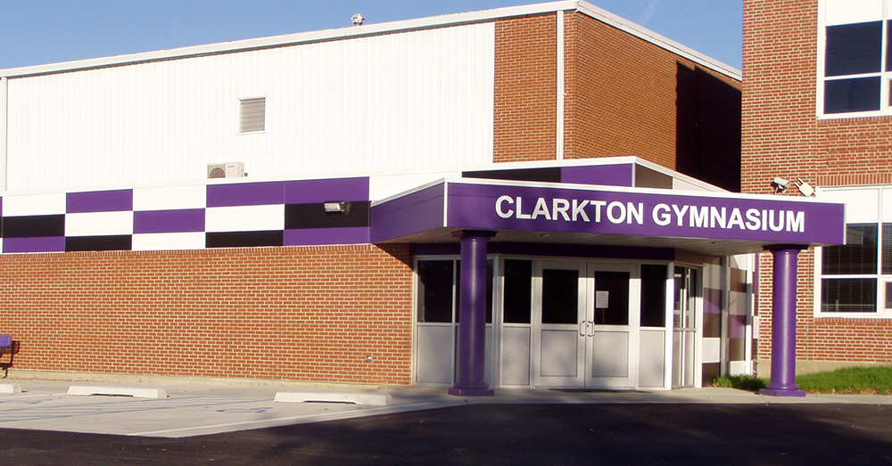 Exterior of Clarkton Gymnasium featuring purple Illumination wall panels