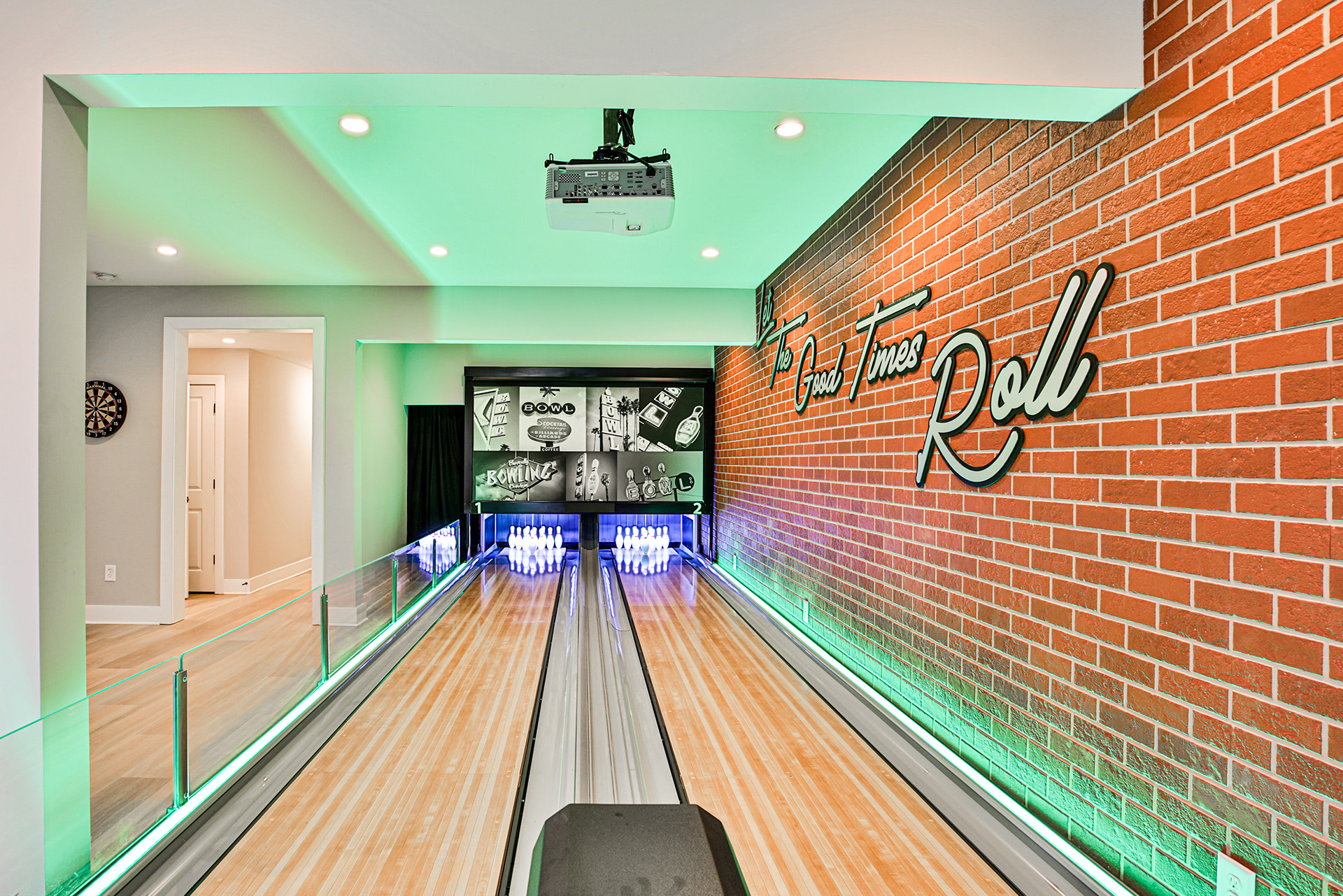 Indoor bowling alley on HGTV's Rock the Block that used PlymouthBrick on an interior wall with Let the Good Times Roll neon sign